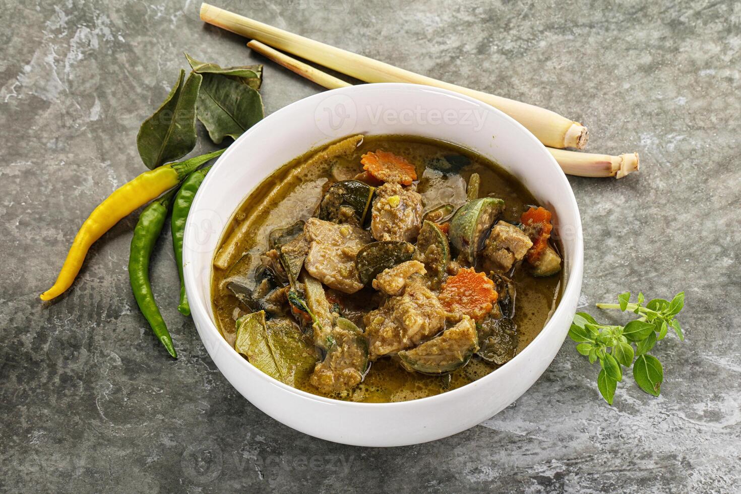 Thai green curry soup with basil photo