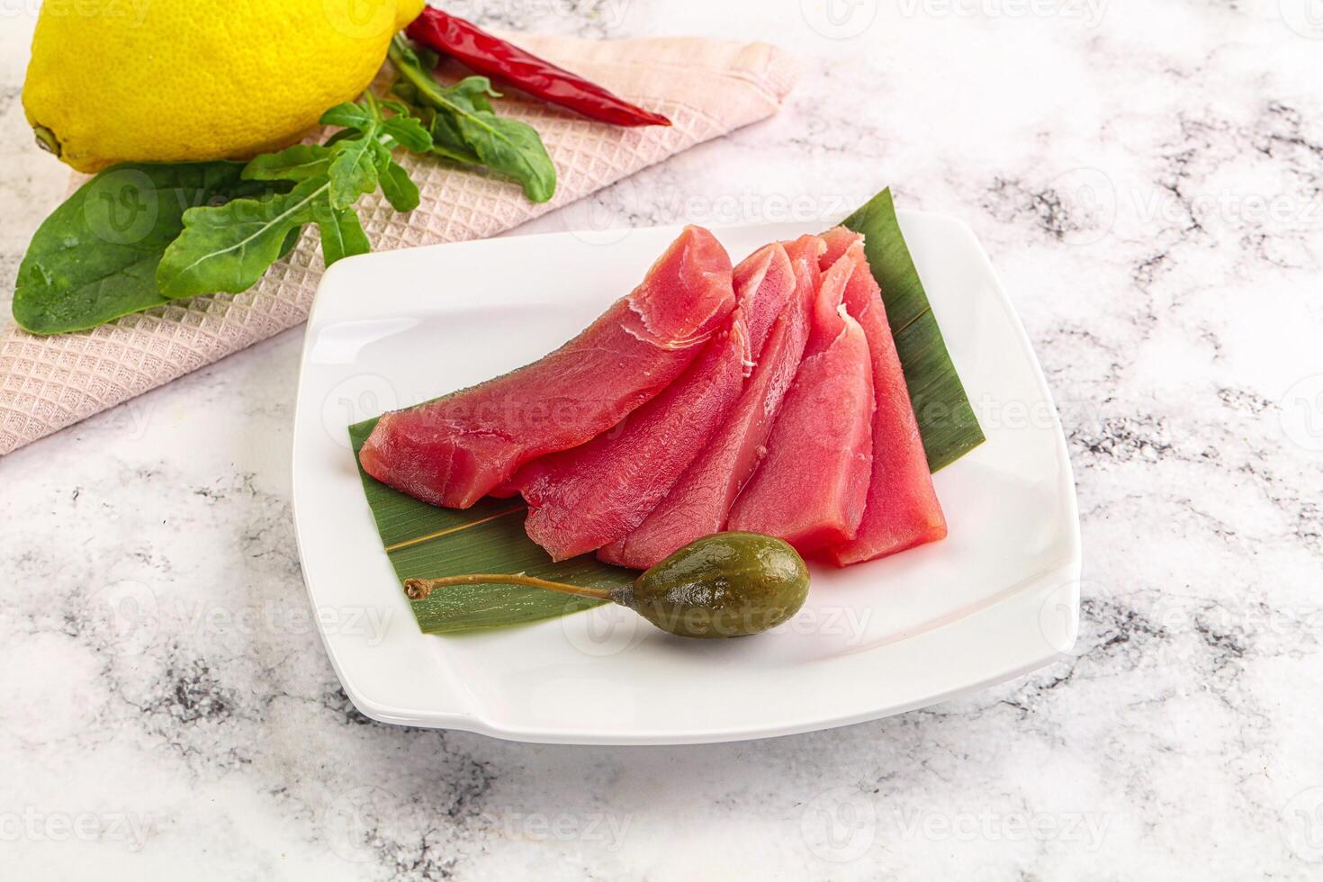 Fresh raw tuna sashimi slices photo