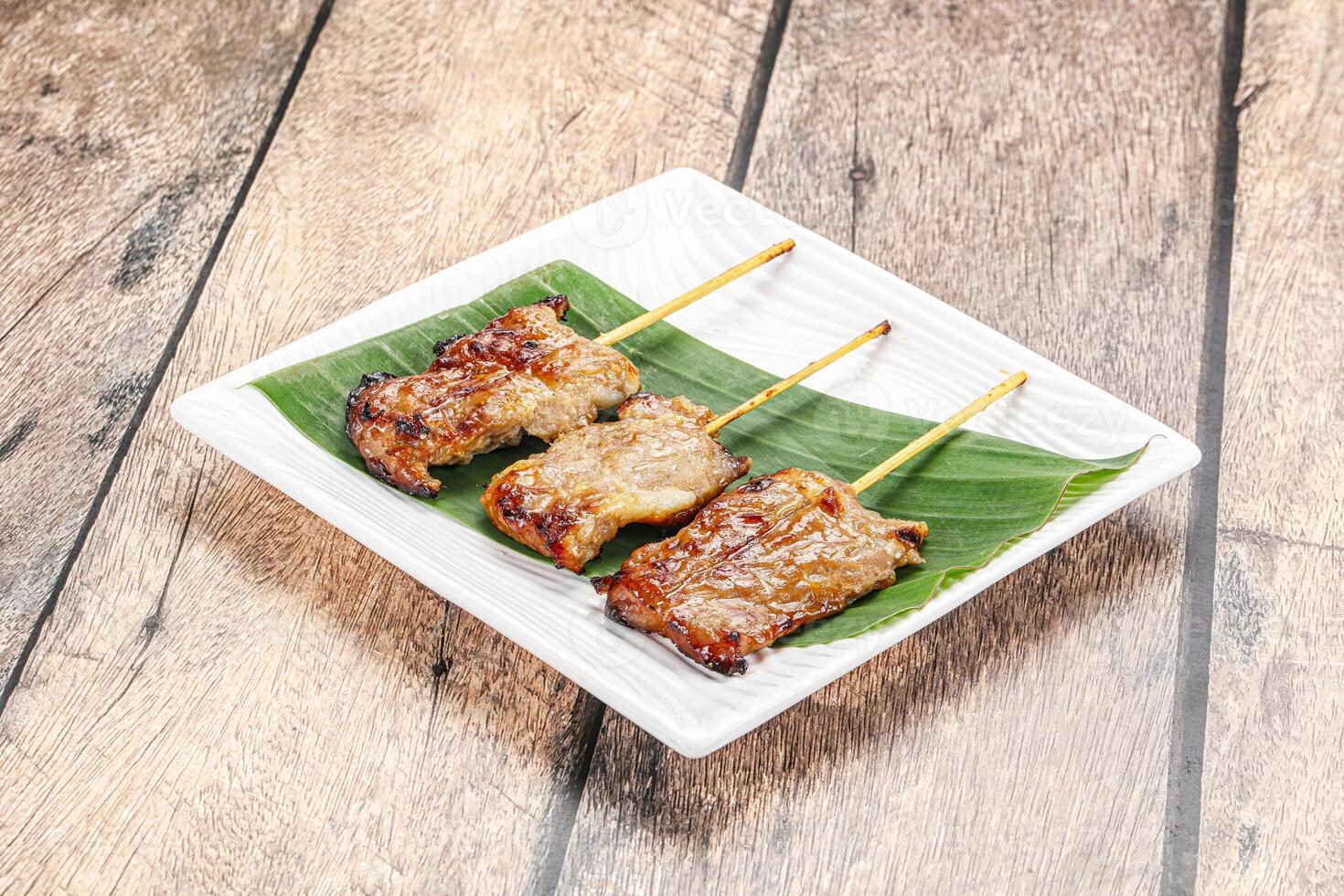 Thai cuisine - grilled pork skewer photo