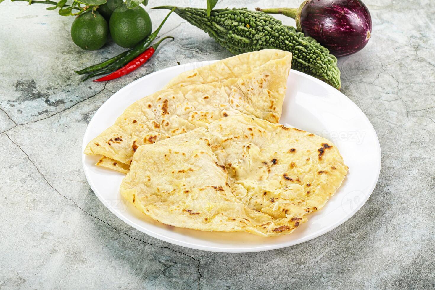 Indian tandori bread - naan with cheese photo