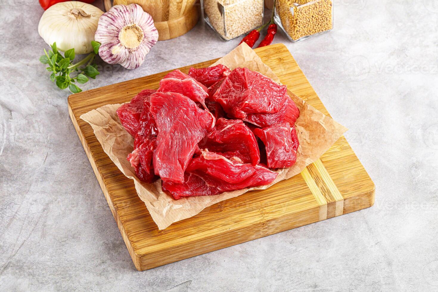 Sliced raw beef meat for cooking photo