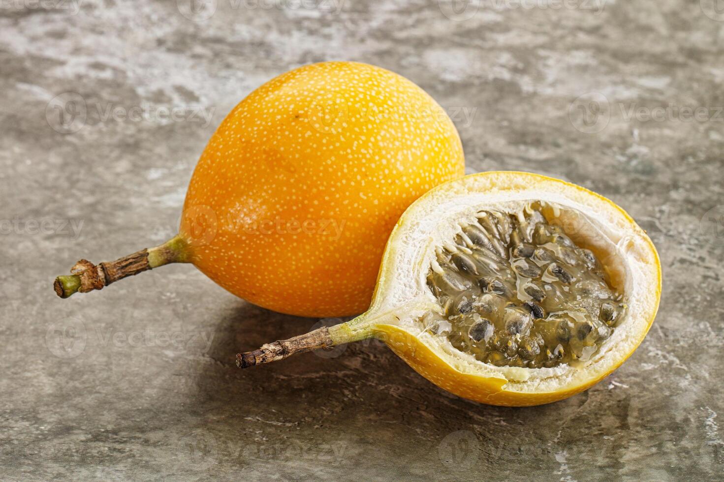 Yellow granadilla with cut half photo