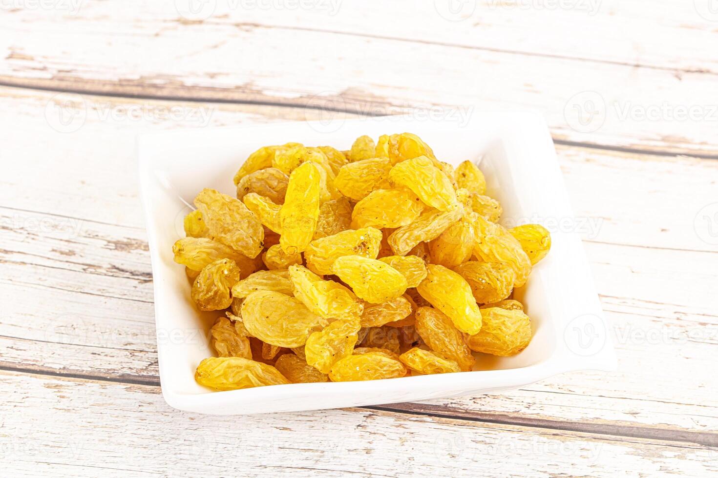 Yellow raisin - dry grape berries photo