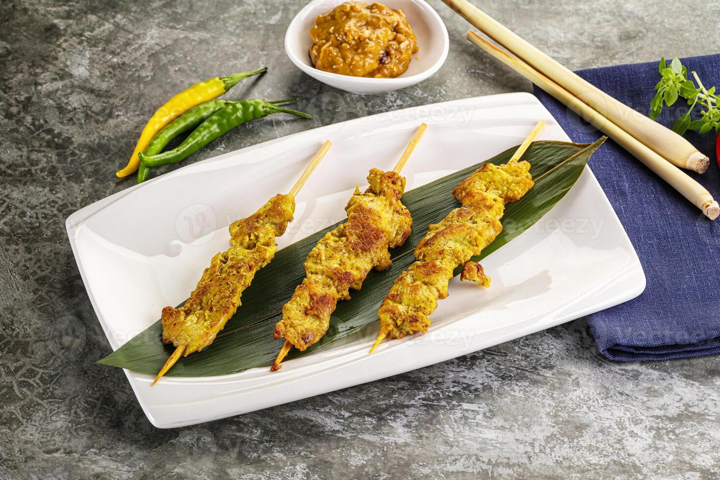 Thai meat skewer Satay with sauce photo