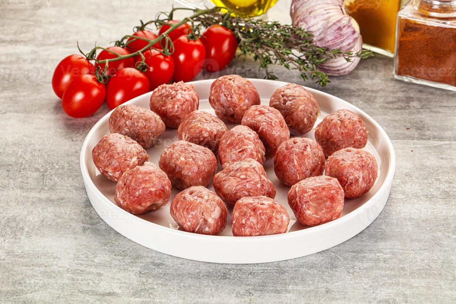 Uncooked raw beef meatball minced photo