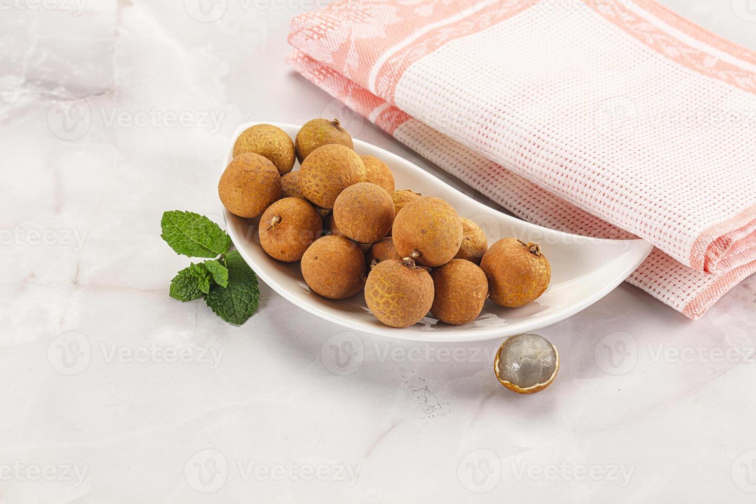 Tropical delicous fruit Longan heap photo