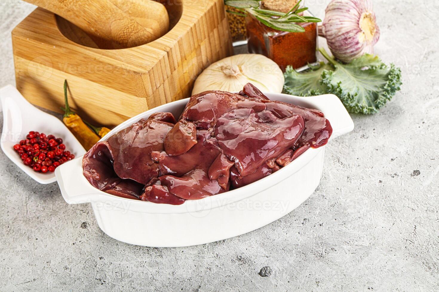 Raw uncooked chicken liver in the bowl photo