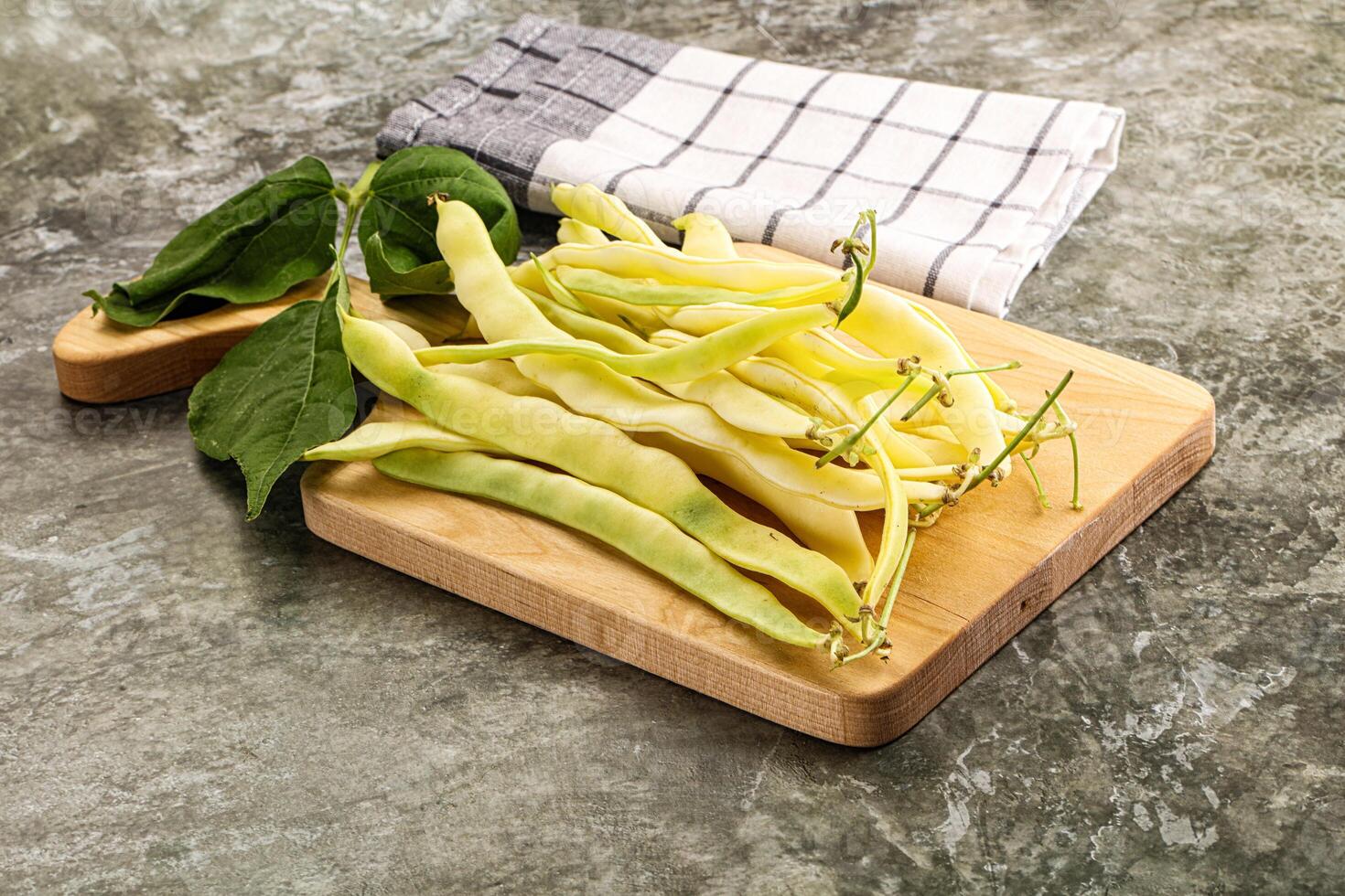 Raw green bean strings heap photo
