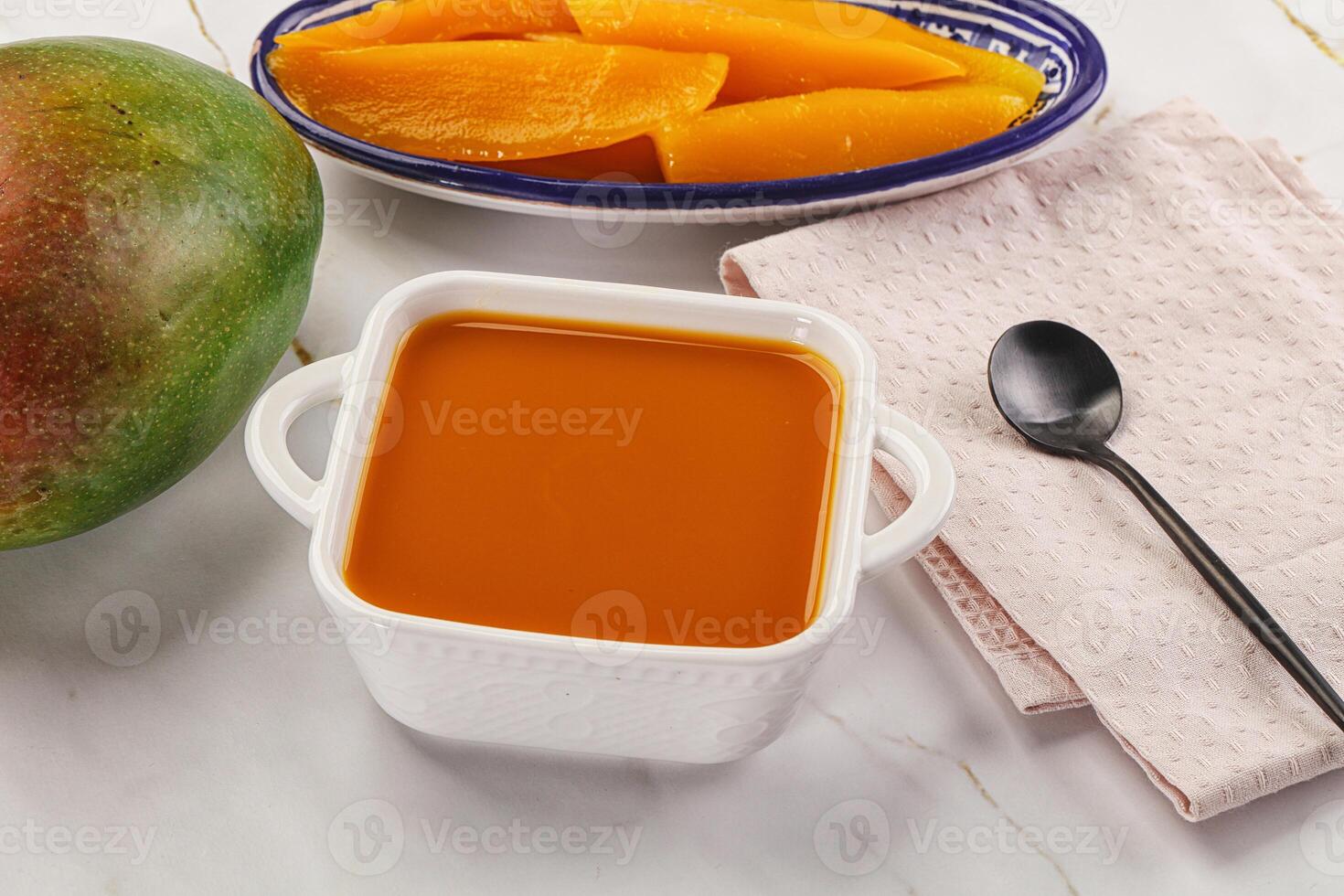 Sweet mango puree in the bowl photo