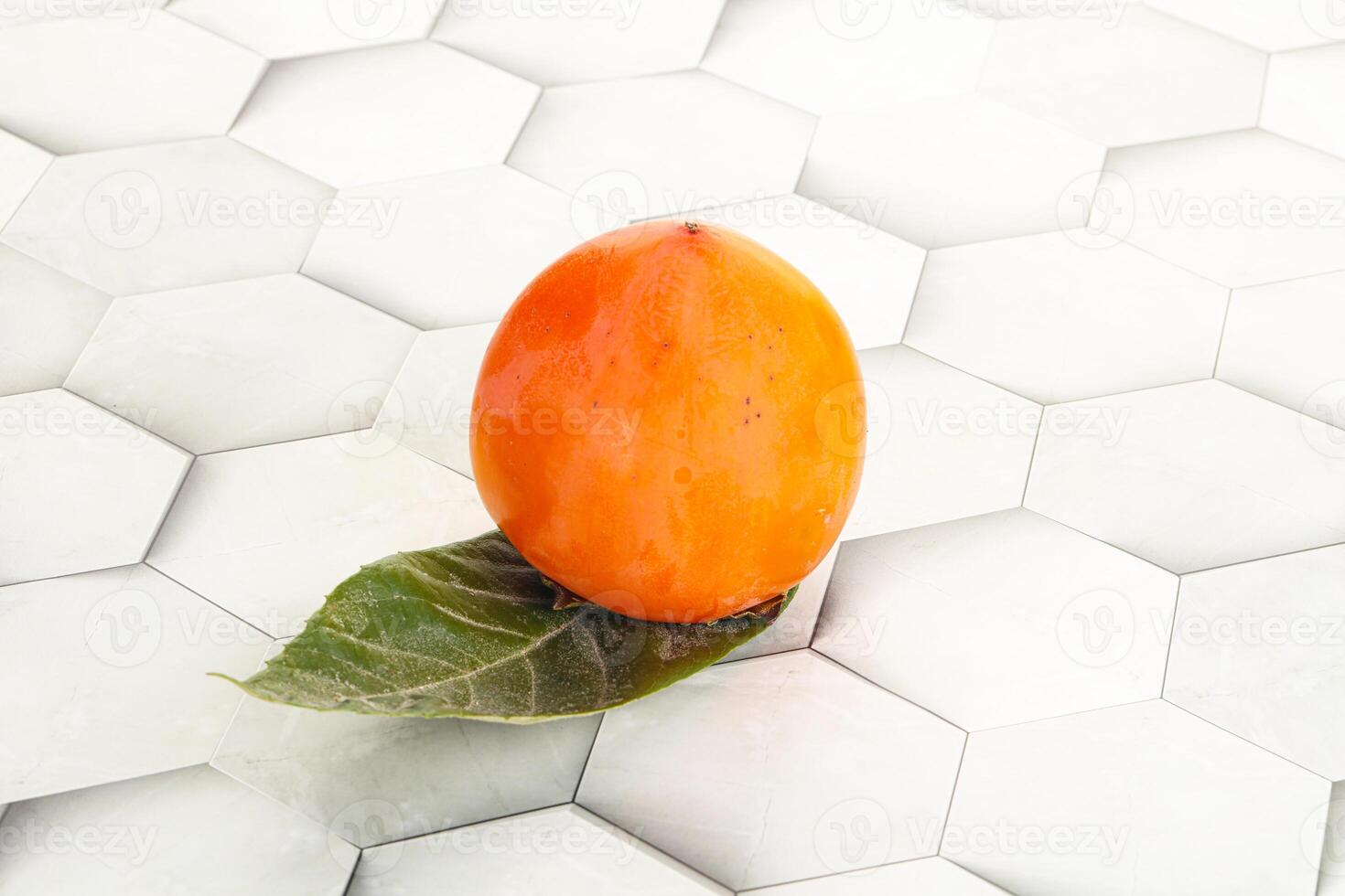 Fresh ripe sweet juicy persimmon photo