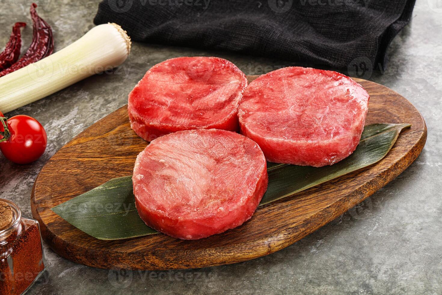 Delicous raw tuna medallion for cooking photo