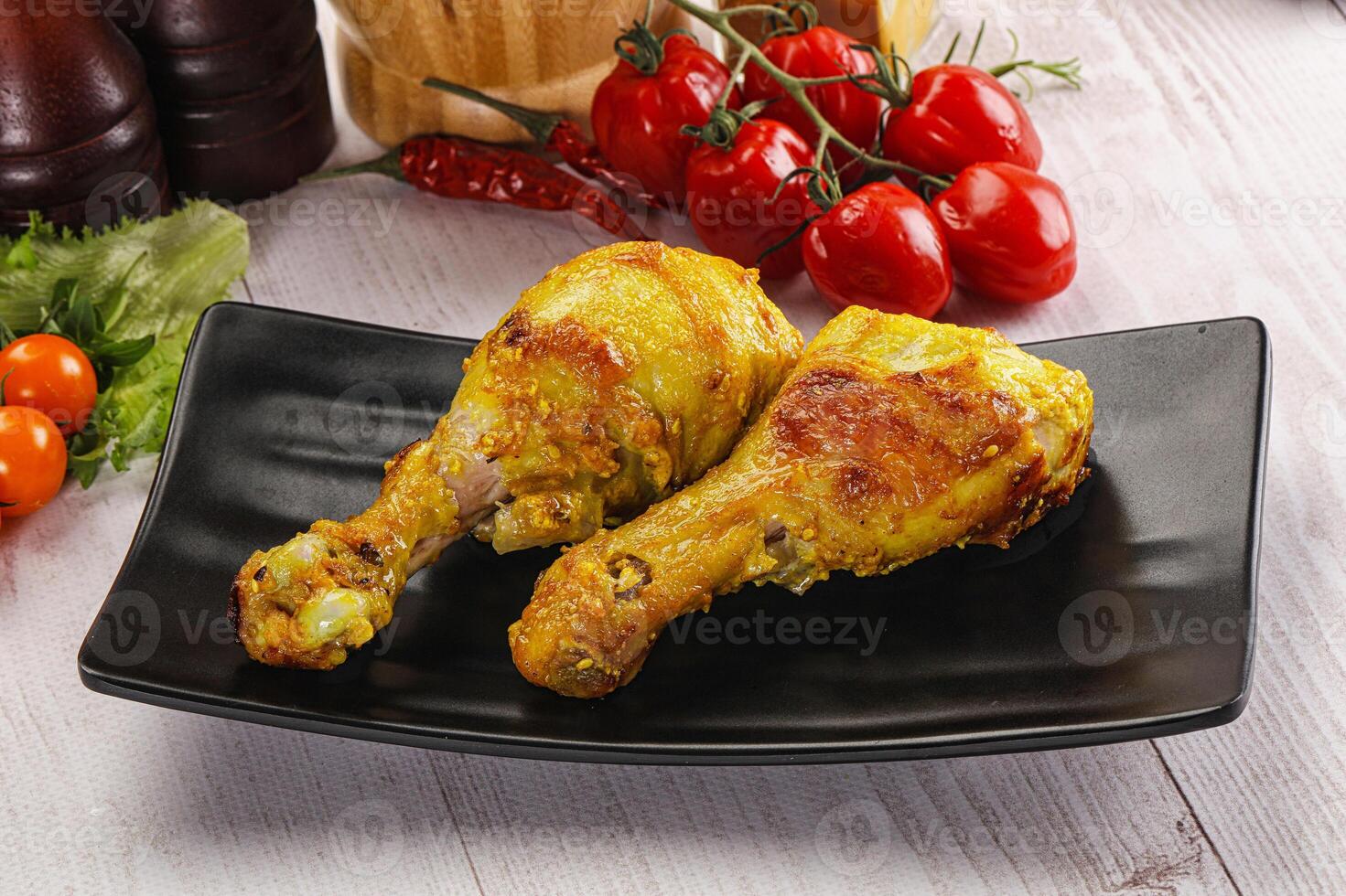 Roasted Chicken leg drumsticks with curry sauce photo