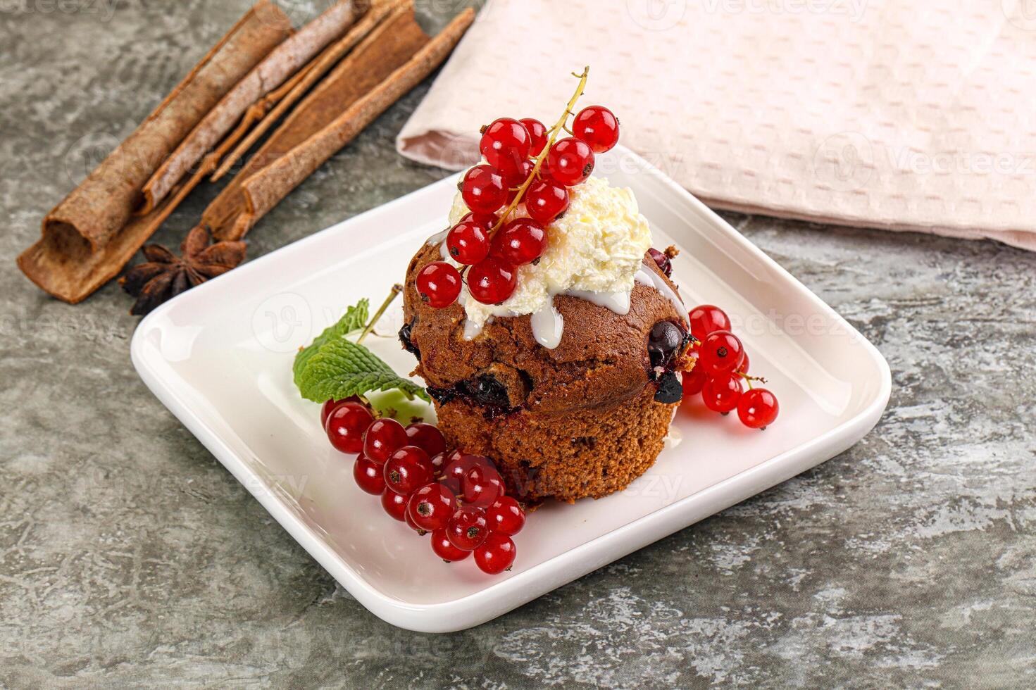 Delicous cupcake with red currant photo