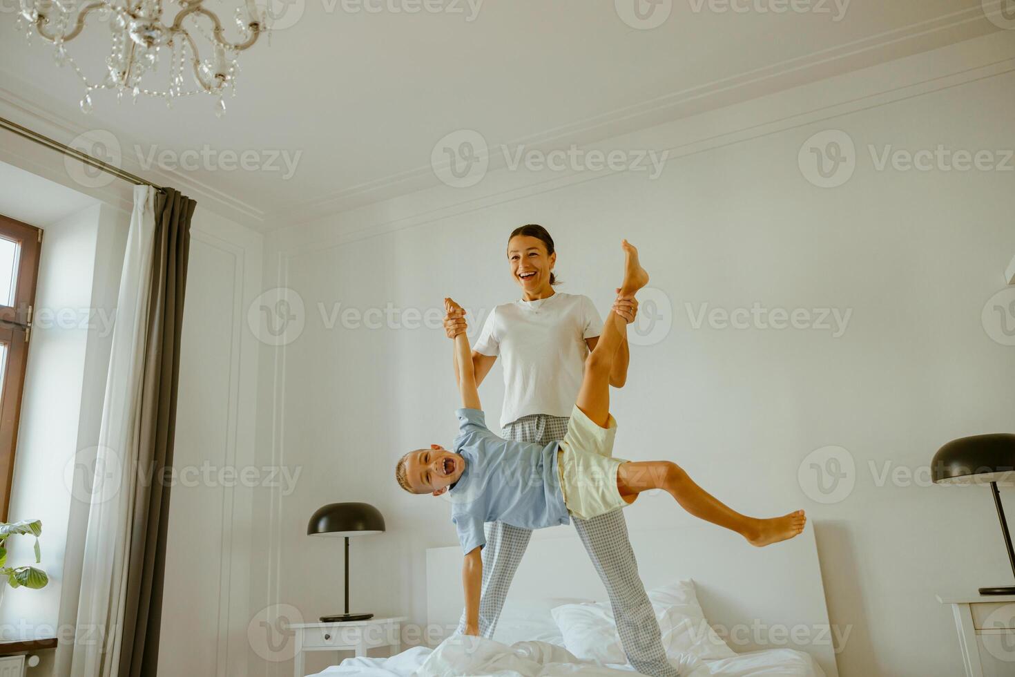 Joyful Indoor Playtime Between Friends While Enjoying a Cozy Room Filled with Laughter photo