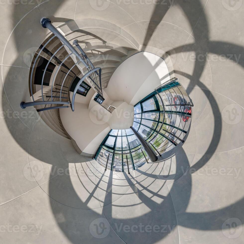 abstractly twisted into spherical 360 panorama interior of modern office with hall staircase and panoramic windows photo
