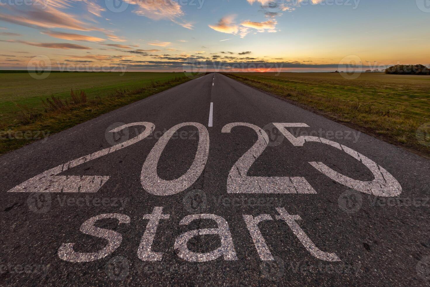 numbers 2025 and start on asphalt road highway with cracks with sunrise or sunset sky background. concept of destination in future, freedom, work start, run, planning, challenge, target, new year photo