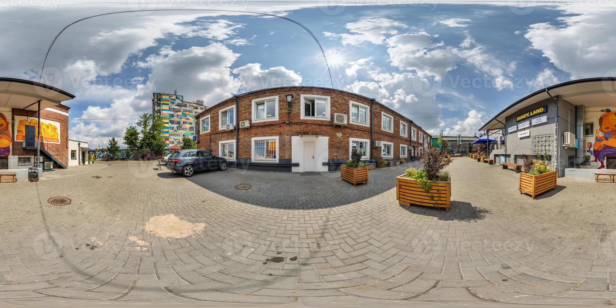 360 hdri panorama on street in courtyard or backyard of city bystreet with graffiti on walls in equirectangular projection, ready for VR AR virtual reality content photo