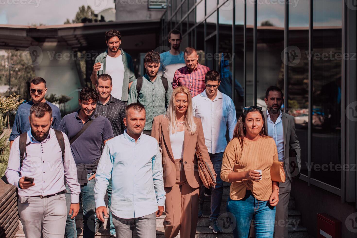 A diverse group of businessmen and colleagues walking together by their workplace, showcasing collaboration and teamwork in the company. photo