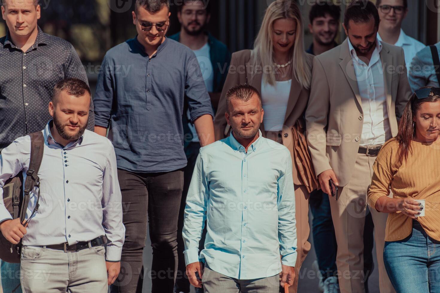 A diverse group of businessmen and colleagues walking together by their workplace, showcasing collaboration and teamwork in the company. photo
