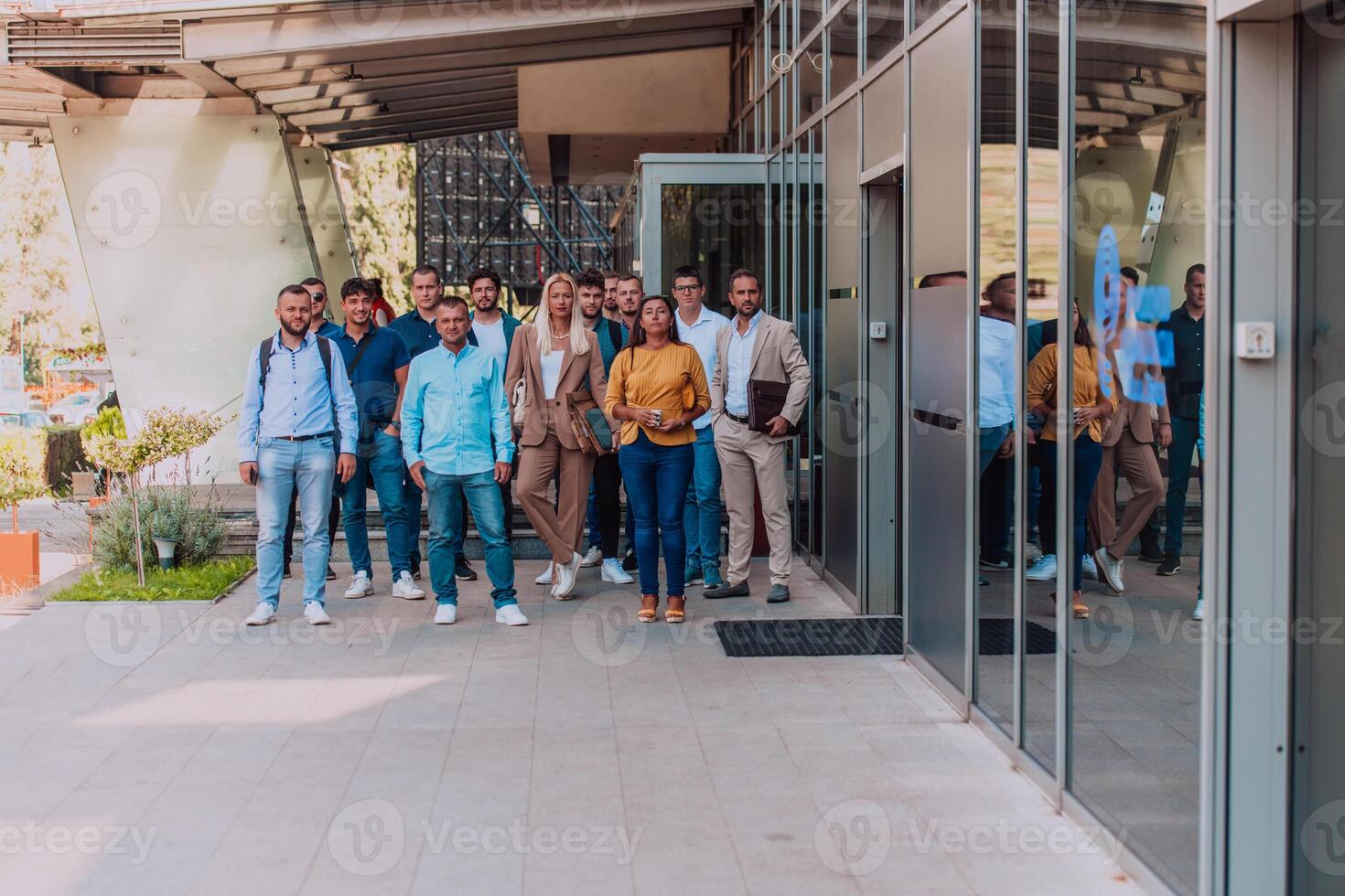 A diverse group of businessmen and colleagues walking together by their workplace, showcasing collaboration and teamwork in the company. photo