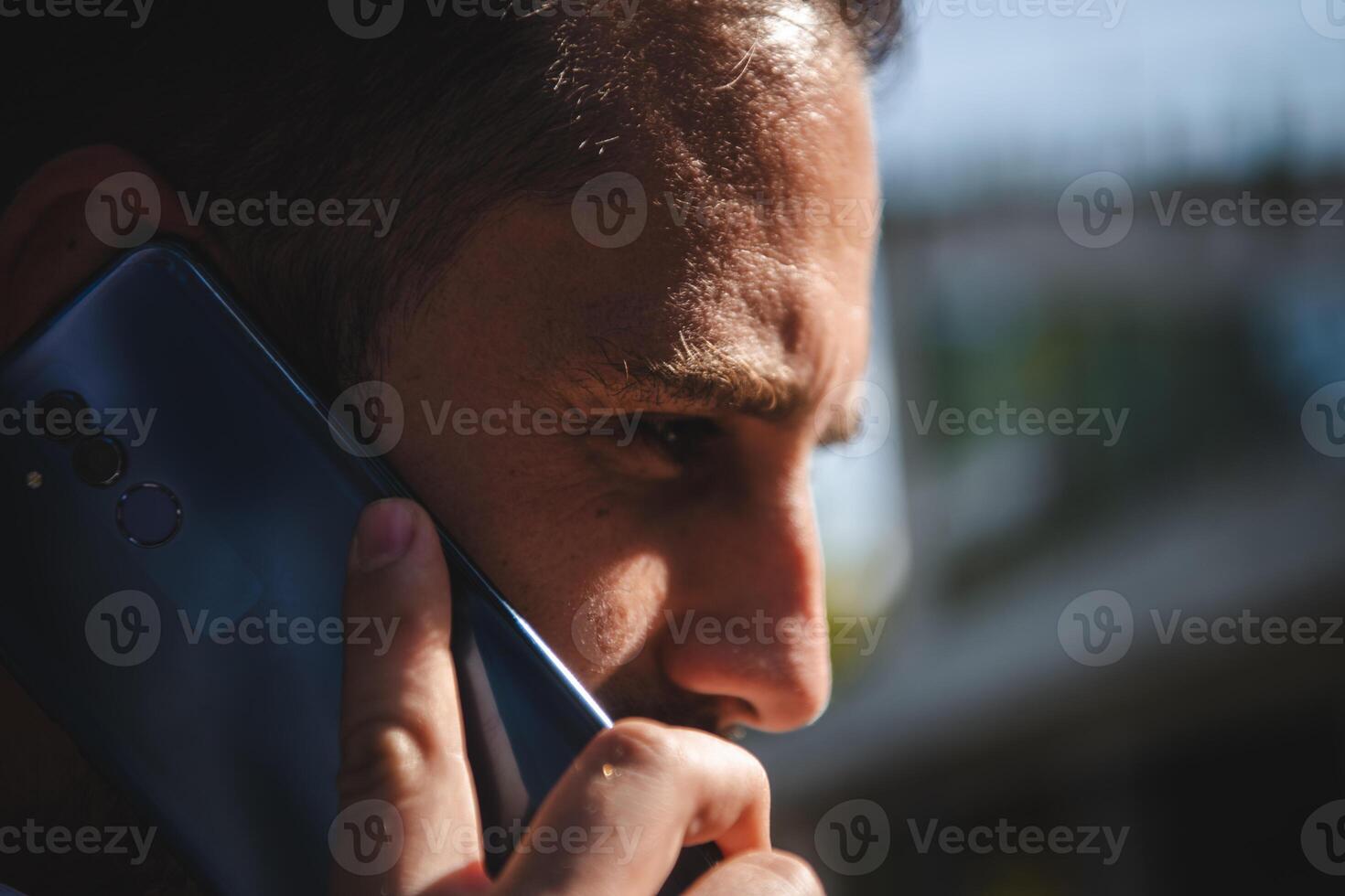 A businessman using his smartphone outdoors, showcasing the seamless integration of technology and mobility in modern professional life. photo