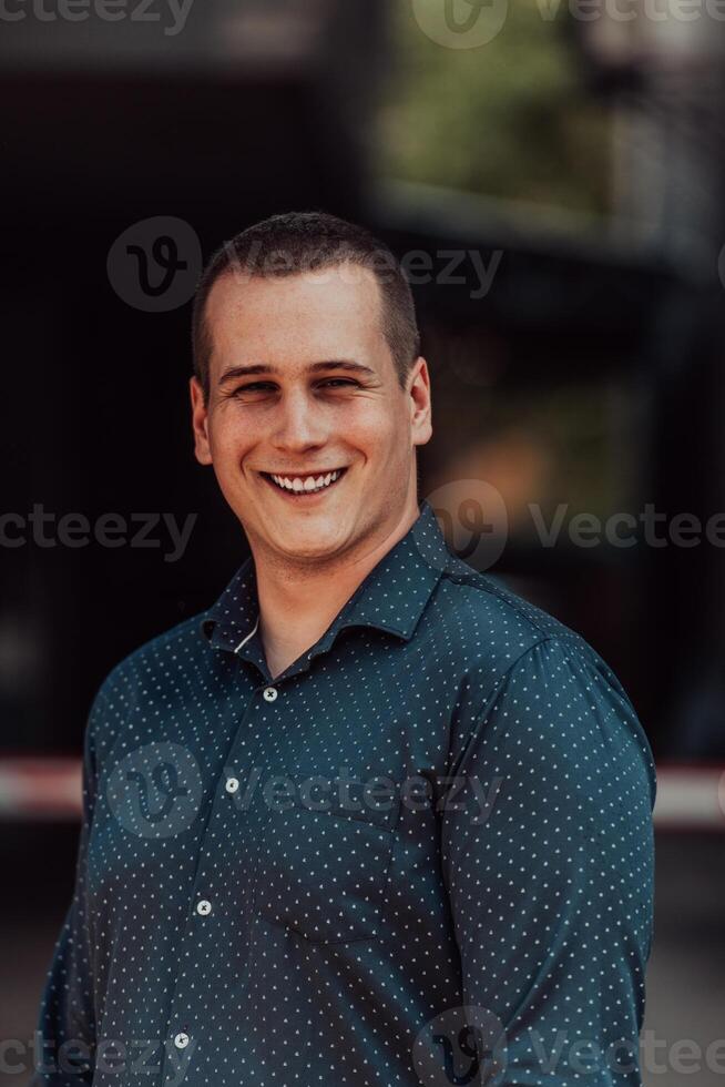 A portrait of a modern man, exuding confidence and style, against an outdoor backdrop, showcasing his charisma and fashionable demeanor. photo