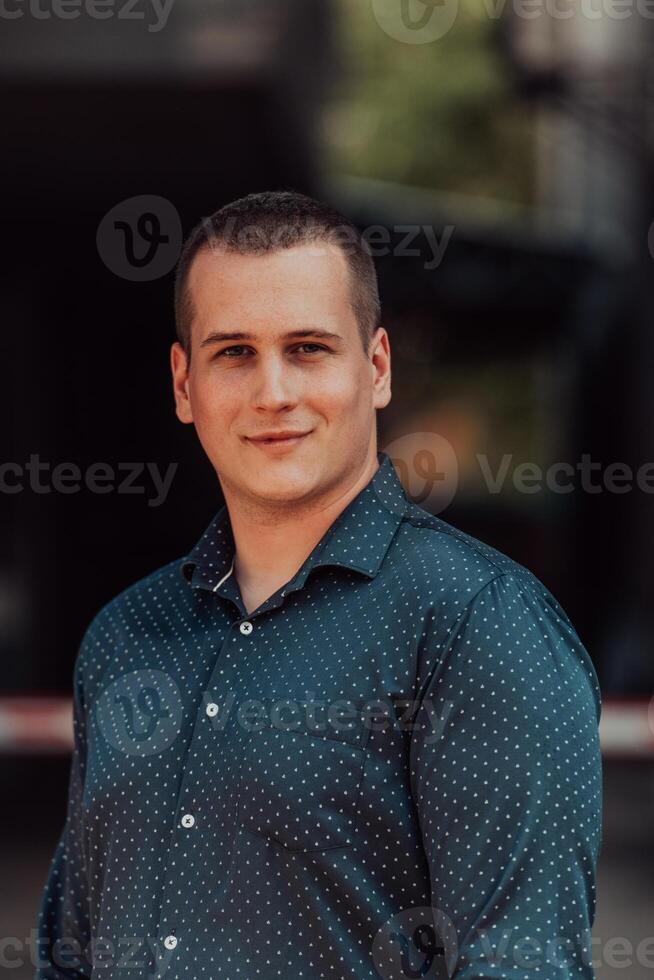 A portrait of a modern man, exuding confidence and style, against an outdoor backdrop, showcasing his charisma and fashionable demeanor. photo