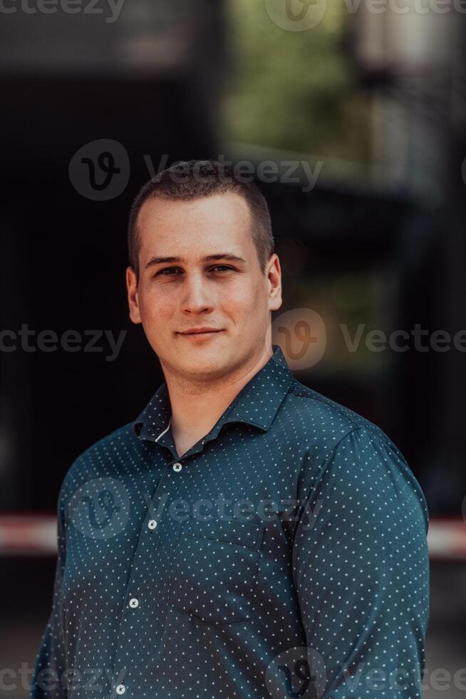 A portrait of a modern man, exuding confidence and style, against an outdoor backdrop, showcasing his charisma and fashionable demeanor. photo