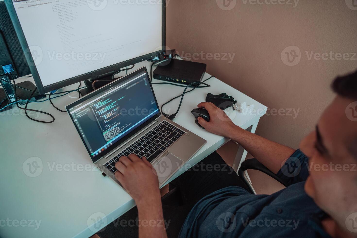 A programmer diligently testing smartphone applications while sitting in their office. photo