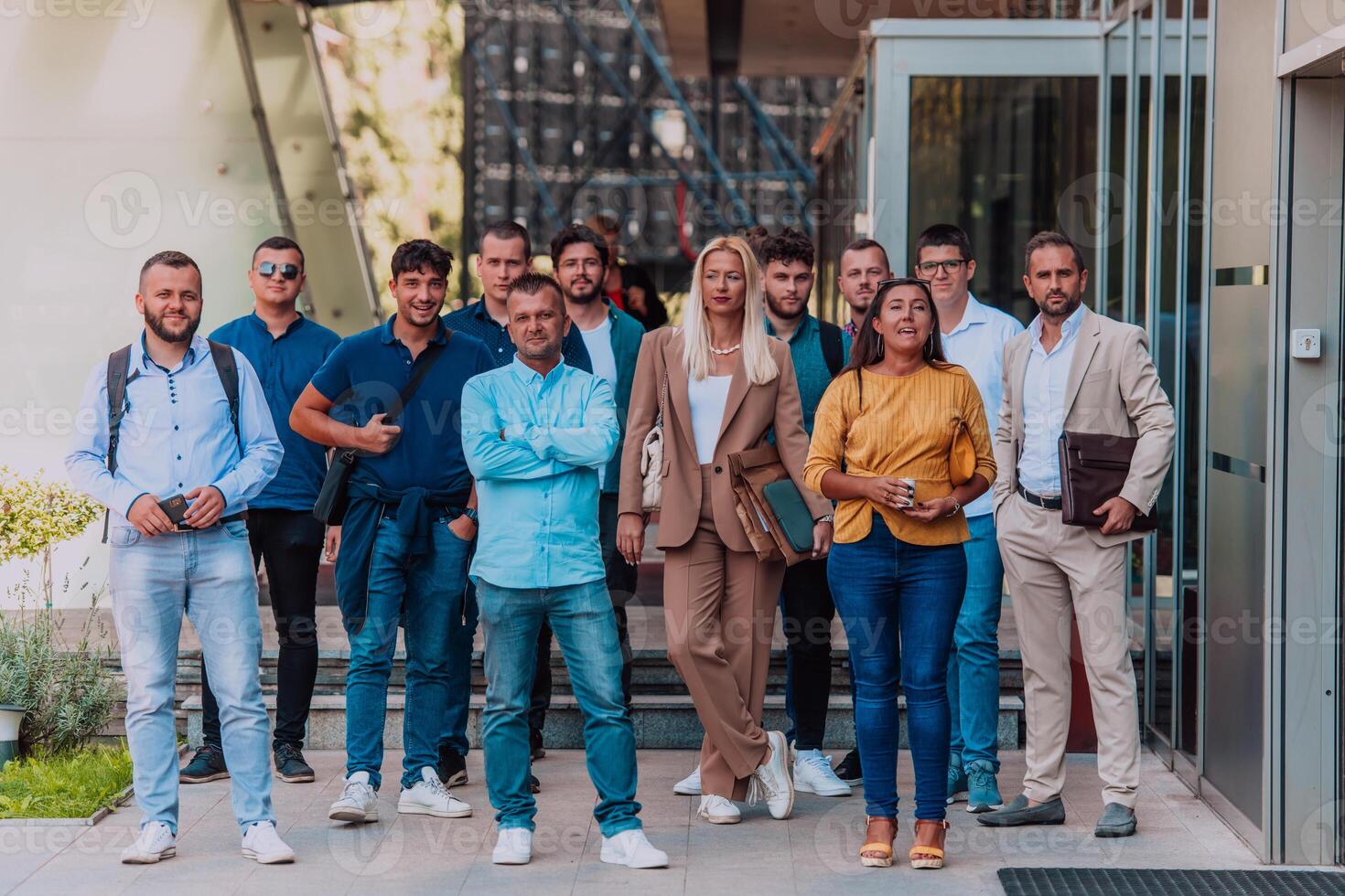 A diverse group of businessmen and colleagues walking together by their workplace, showcasing collaboration and teamwork in the company. photo
