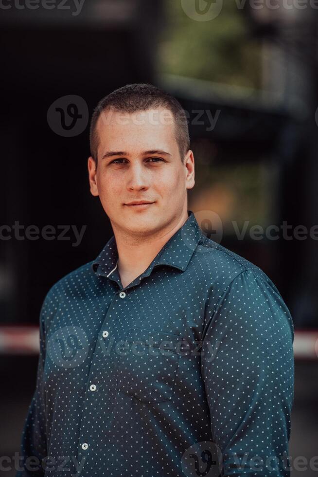 A portrait of a modern man, exuding confidence and style, against an outdoor backdrop, showcasing his charisma and fashionable demeanor. photo