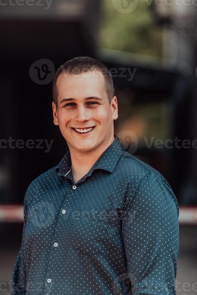 A portrait of a modern man, exuding confidence and style, against an outdoor backdrop, showcasing his charisma and fashionable demeanor. photo