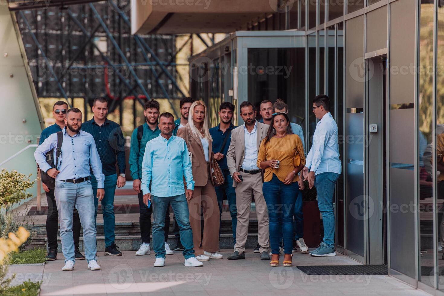 A diverse group of businessmen and colleagues walking together by their workplace, showcasing collaboration and teamwork in the company. photo