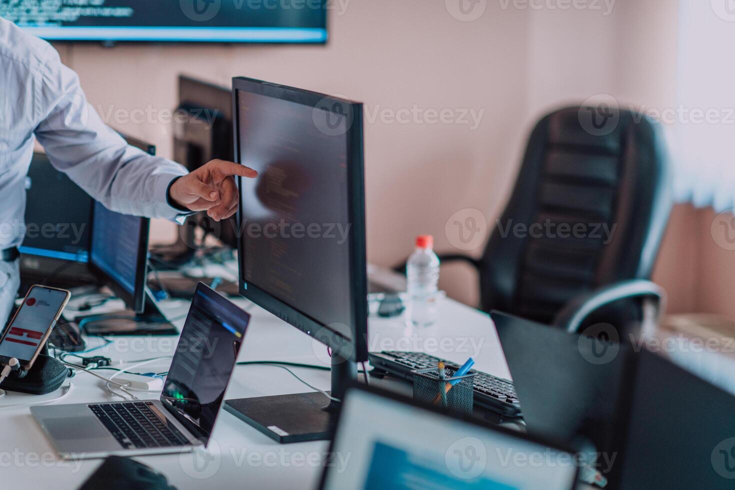 Programmers engrossed in deep collaboration, diligently working together to solve complex problems and develop innovative mobile applications with seamless functionality. photo