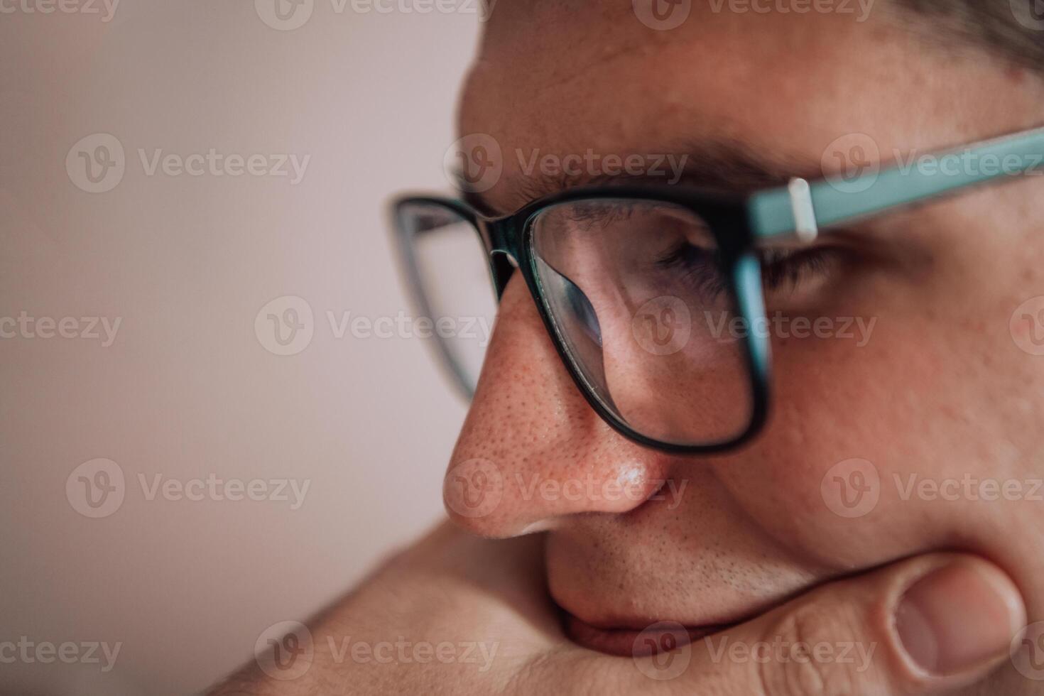 A programmer diligently testing smartphone applications while sitting in their office. photo