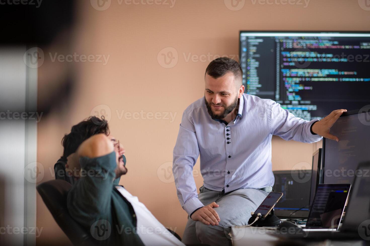 Programmers engrossed in deep collaboration, diligently working together to solve complex problems photo