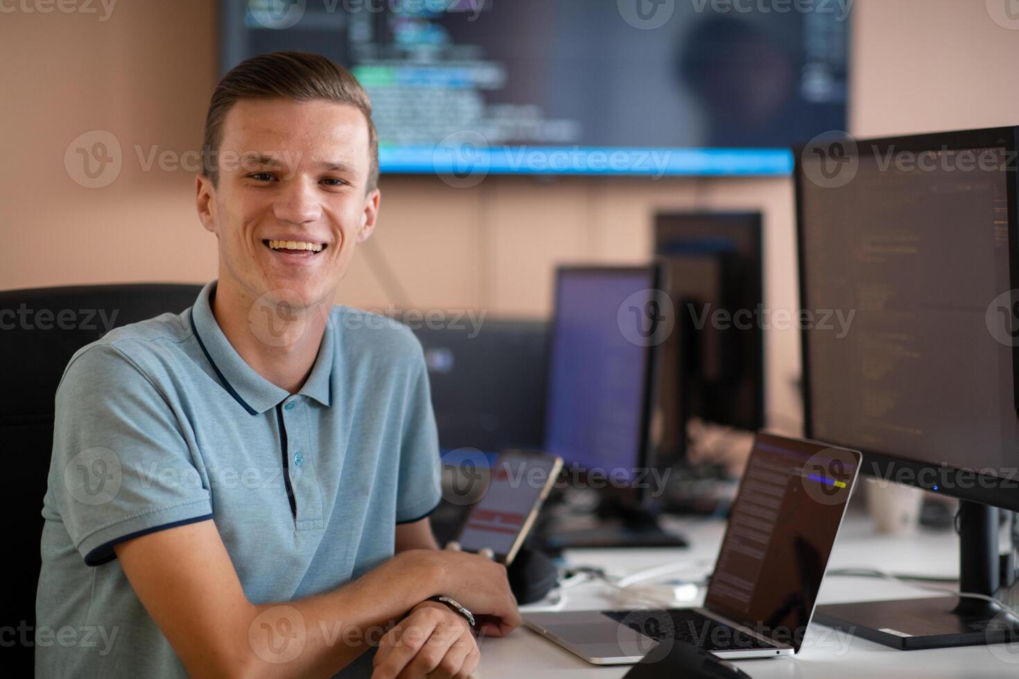 Innovating the Future. A Young Programmer Testing New Smartphone Apps in the Office. photo