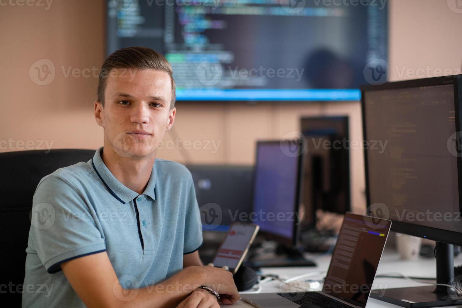 Innovating the Future. A Young Programmer Testing New Smartphone Apps in the Office. photo