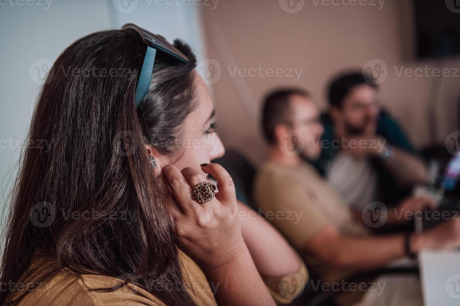 Programmers engrossed in deep collaboration, diligently working together to solve complex problems and develop innovative mobile applications with seamless functionality. photo