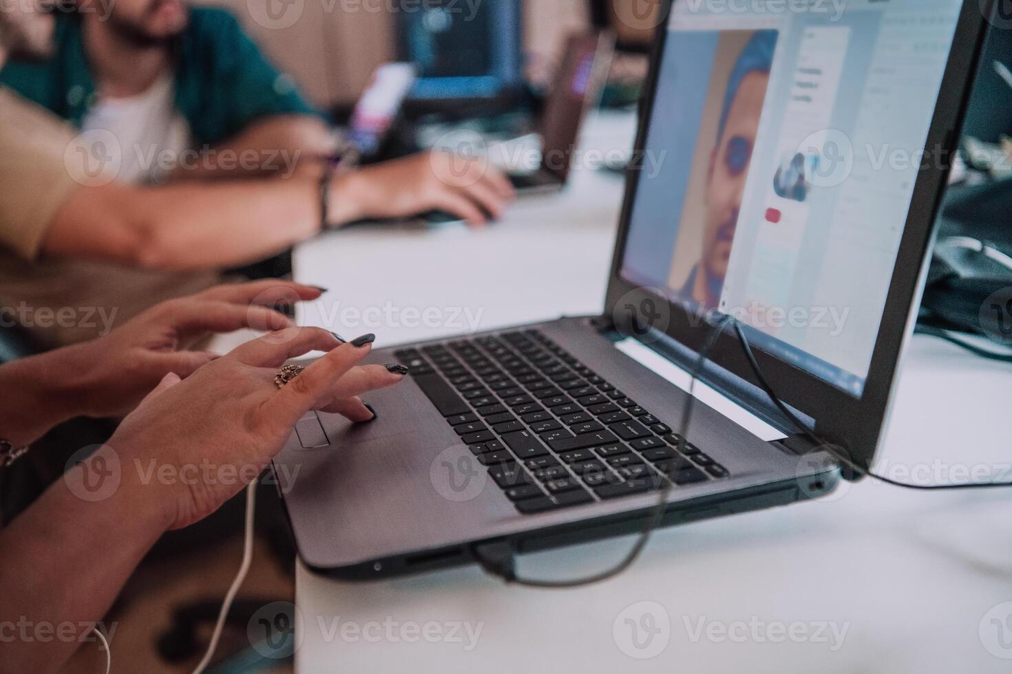 Close up image of woman hands typing on laptop computer keyboard and surfing the internet on office table, online, working, business and technology, internet network communication concept photo