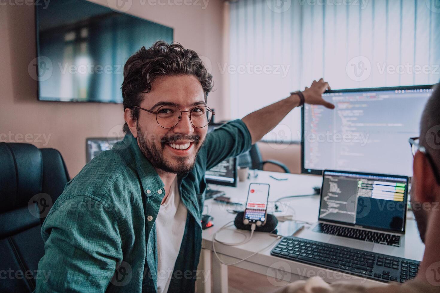 Programmers engrossed in deep collaboration, diligently working together to solve complex problems and develop innovative mobile applications with seamless functionality. photo