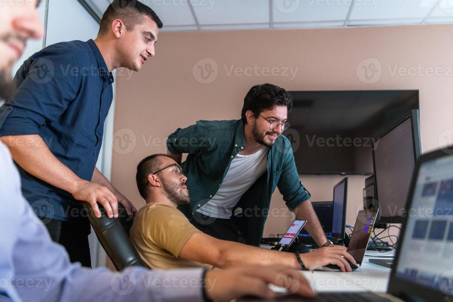 Collaborative Minds. A Team of Programmers Tackling Challenges Together in the Office. photo