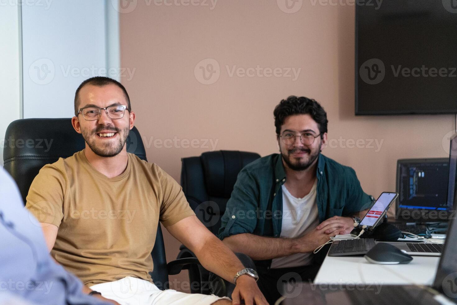 Collaborative Minds. A Team of Programmers Tackling Challenges Together in the Office. photo