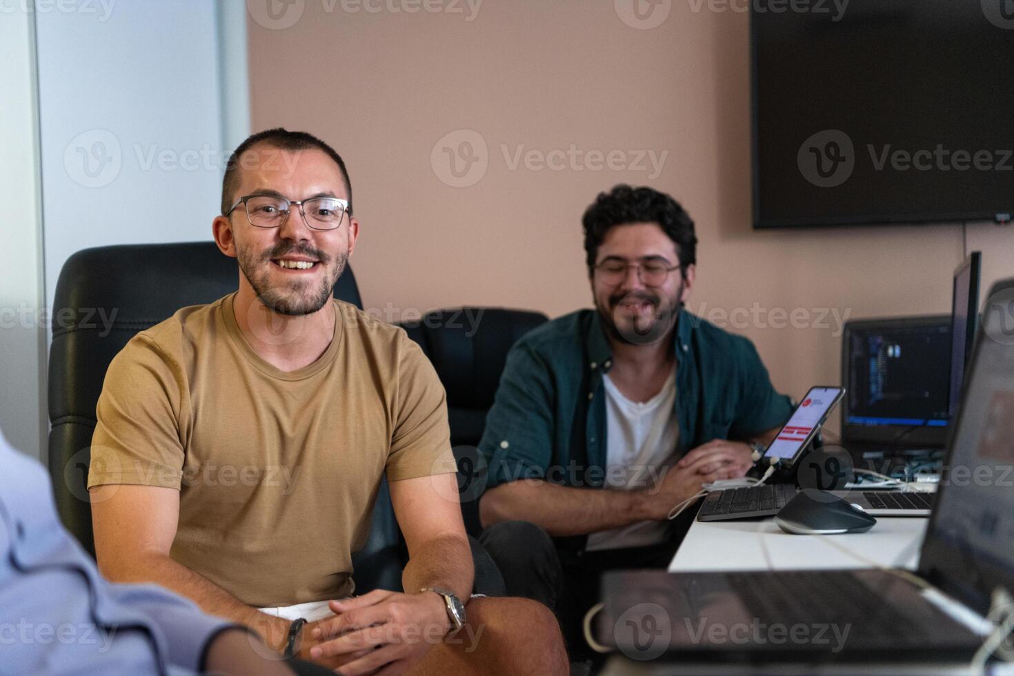 Collaborative Minds. A Team of Programmers Tackling Challenges Together in the Office. photo