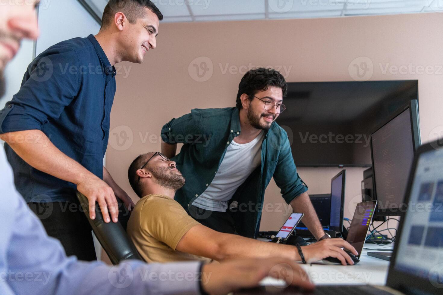 Collaborative Minds. A Team of Programmers Tackling Challenges Together in the Office. photo