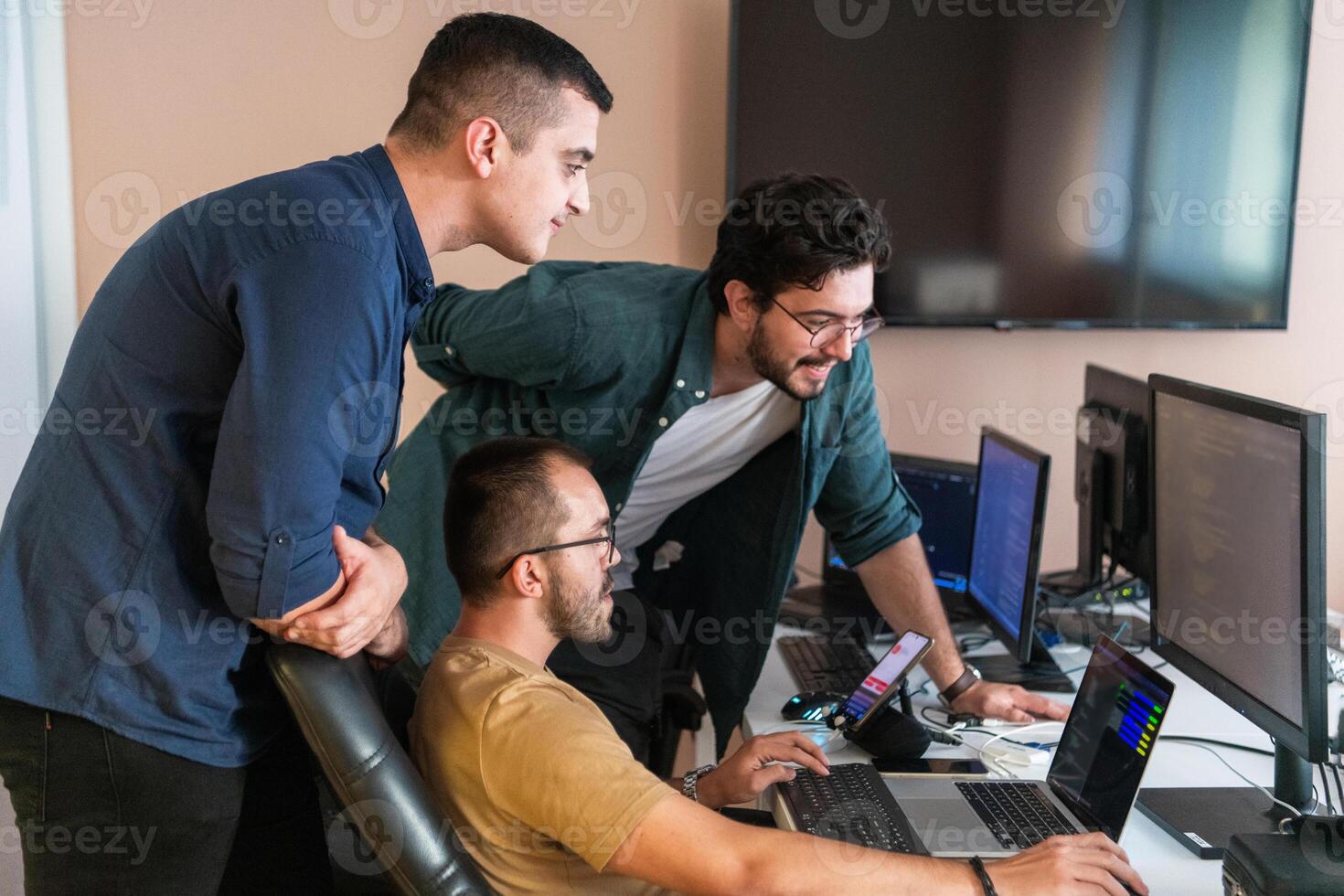 Collaborative Minds. A Team of Programmers Tackling Challenges Together in the Office. photo