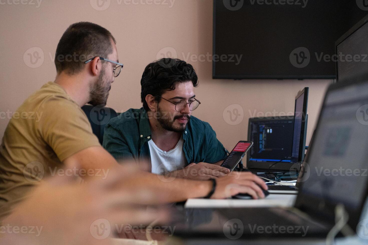 Collaborative Minds. A Team of Programmers Tackling Challenges Together in the Office. photo