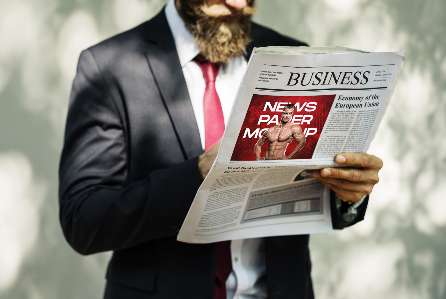 A man in a suit is reading a newspaper psd
