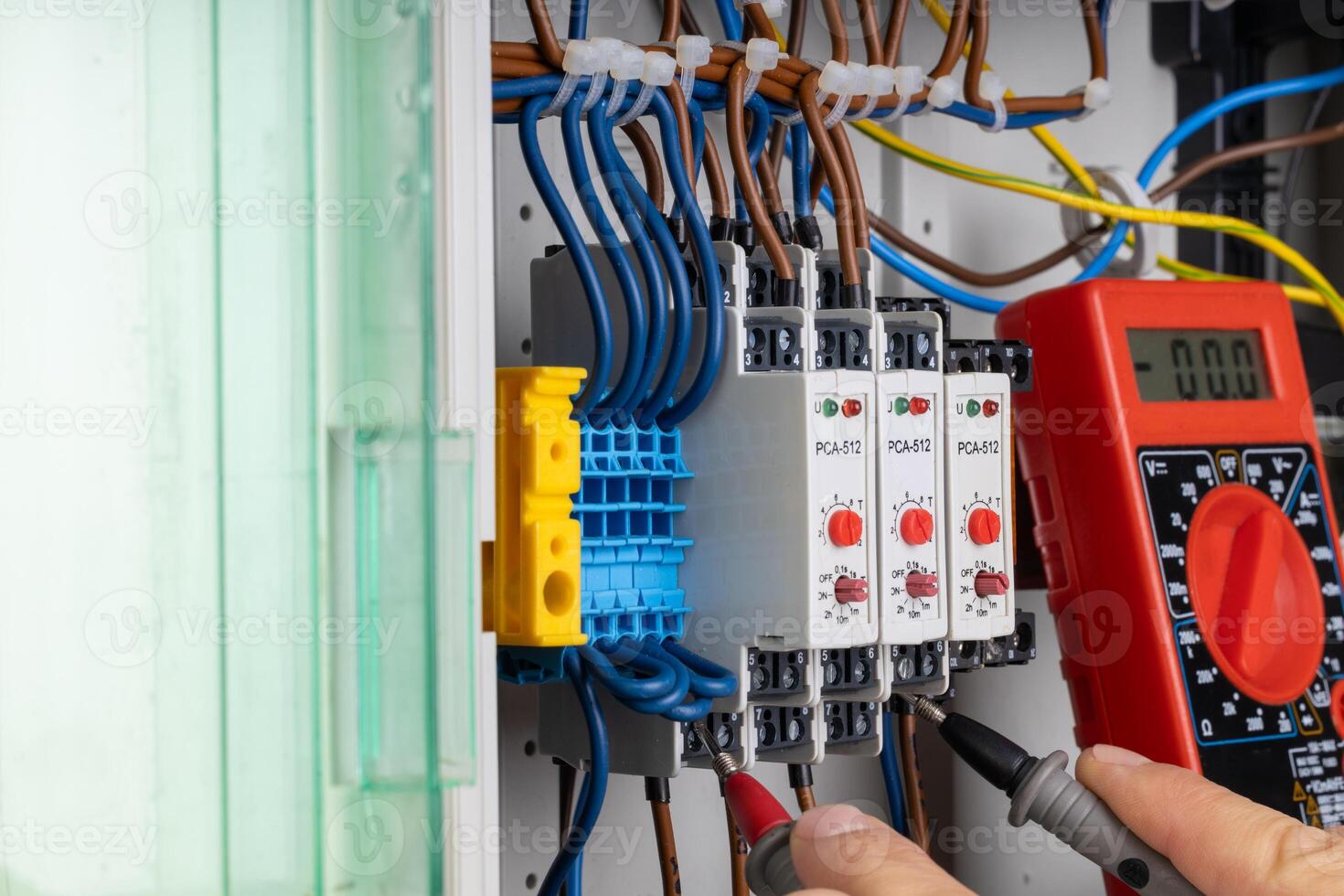 Electrician Testing Circuit Connections with Multimeter photo
