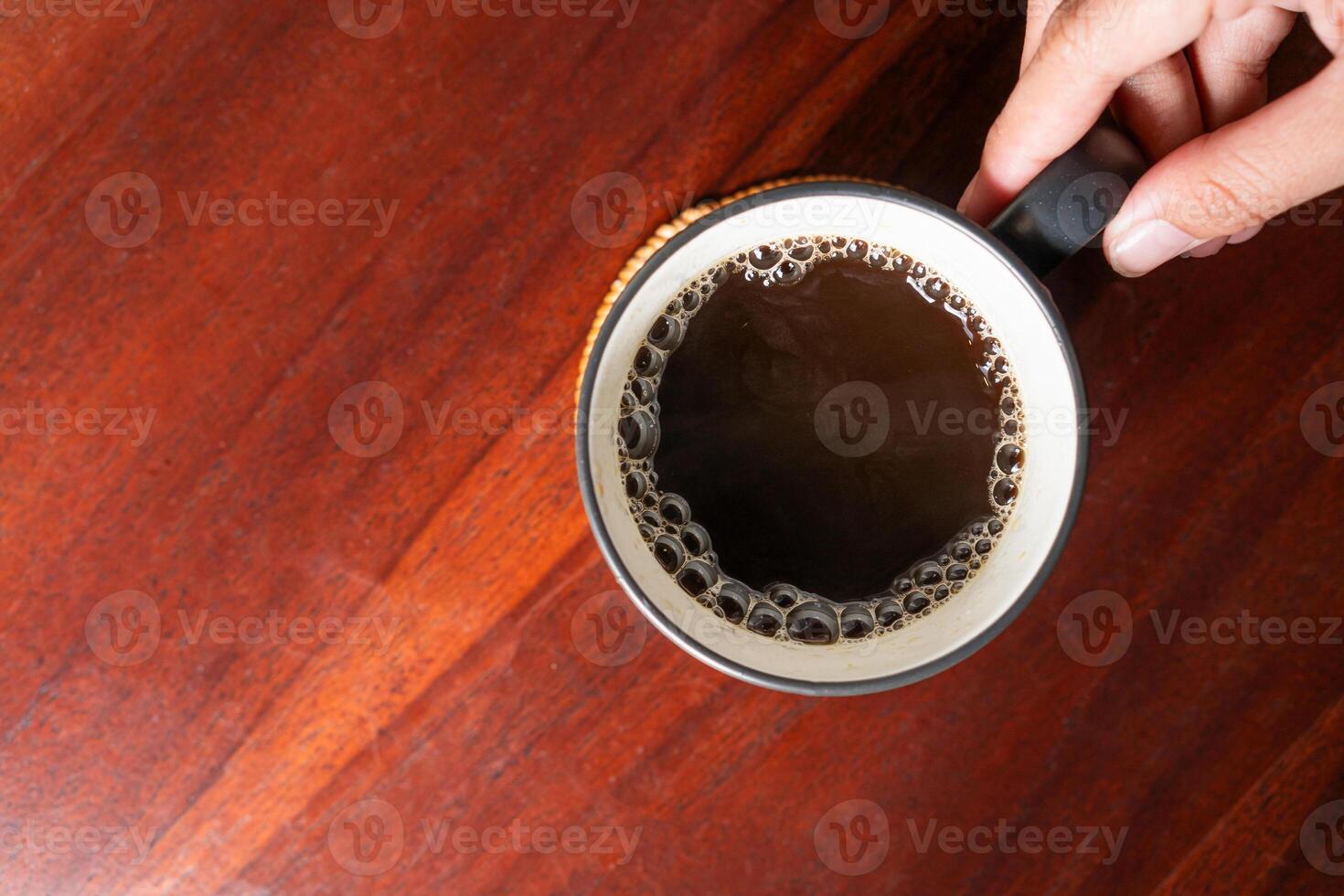 Top View of Coffee Mug on Wooden Table photo